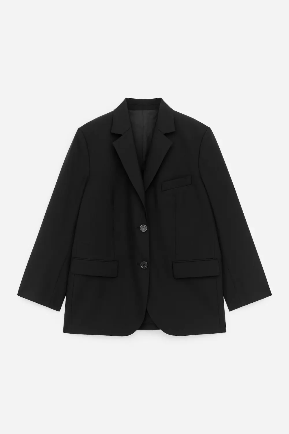 Rentrée 2026 : les 5 pièces d'allure qui font pivoter tout le dressing 2 Blazer noir en laine nattée Arket à la coupe droite et col à revers.